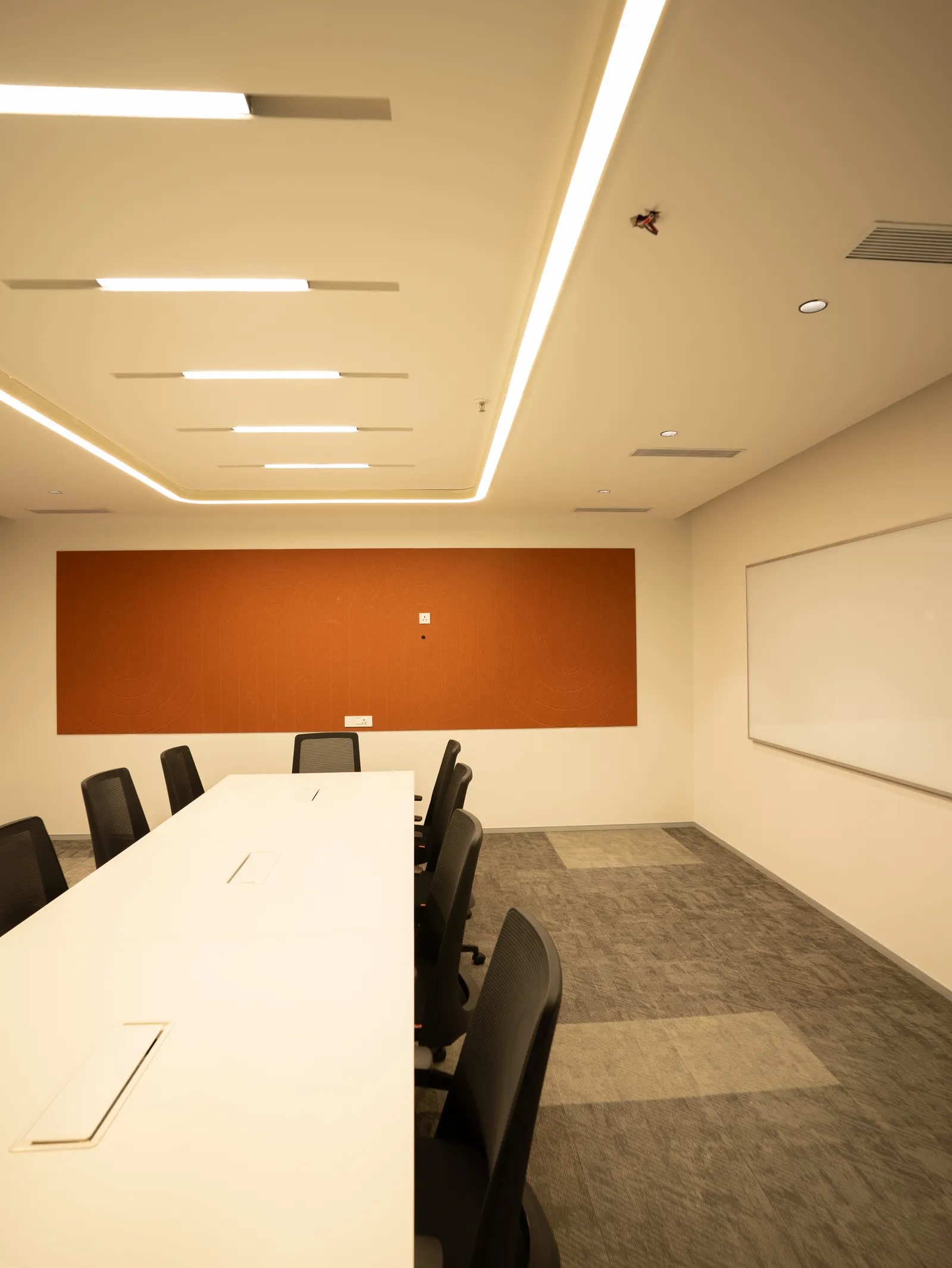 Conference room with orange acoustic panel — Moschip